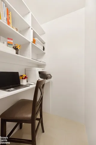 a dining room with a table and chairs