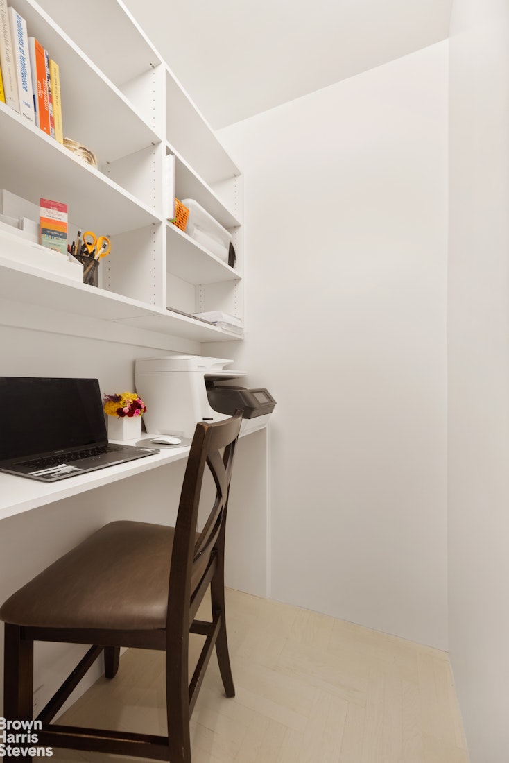 a dining room with a table and chairs