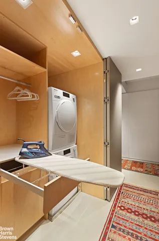 a bathroom with a toilet a sink and a mirror