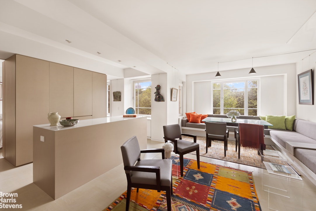 880 5th Avenue, Unit 7C Manhattan, NY 10021 - Photo 3 of 13 a living room with furniture and a large window