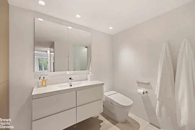 a bedroom with bed and wall painting