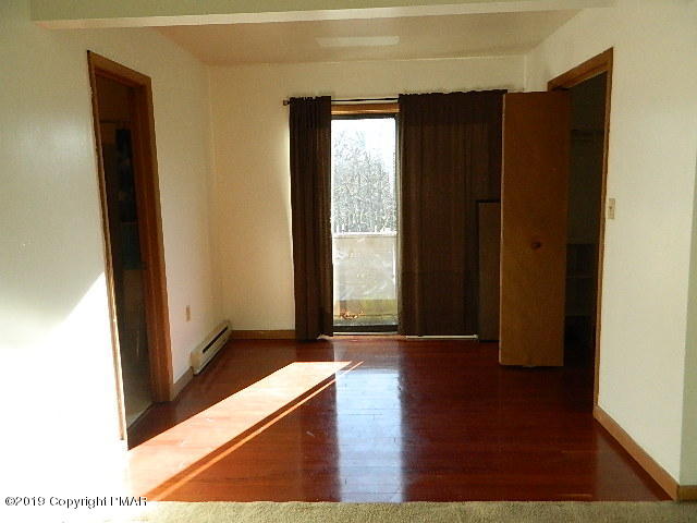 152 Chestnut Drive Bushkill, PA 18324 - Photo 20 of 34 a view of an empty room with wooden floor