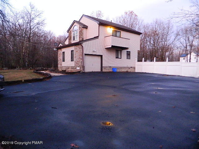152 Chestnut Drive Bushkill, PA 18324 - Photo 2 of 34 a front view of a house with a yard