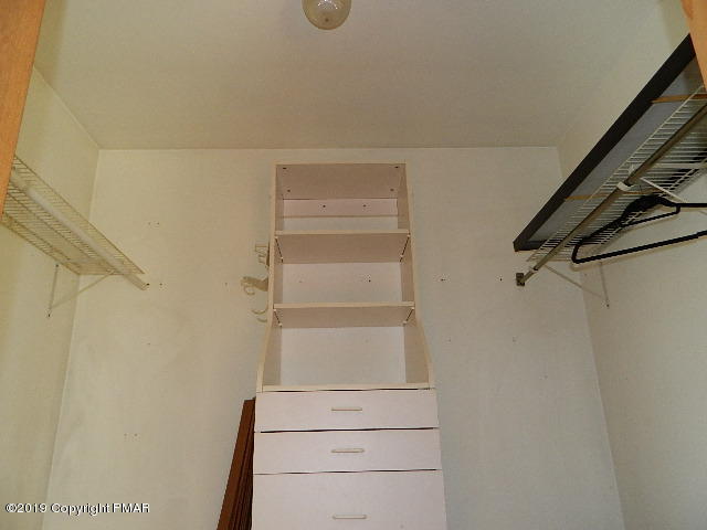 152 Chestnut Drive Bushkill, PA 18324 - Photo 22 of 34 a view of walk in closet with empty racks