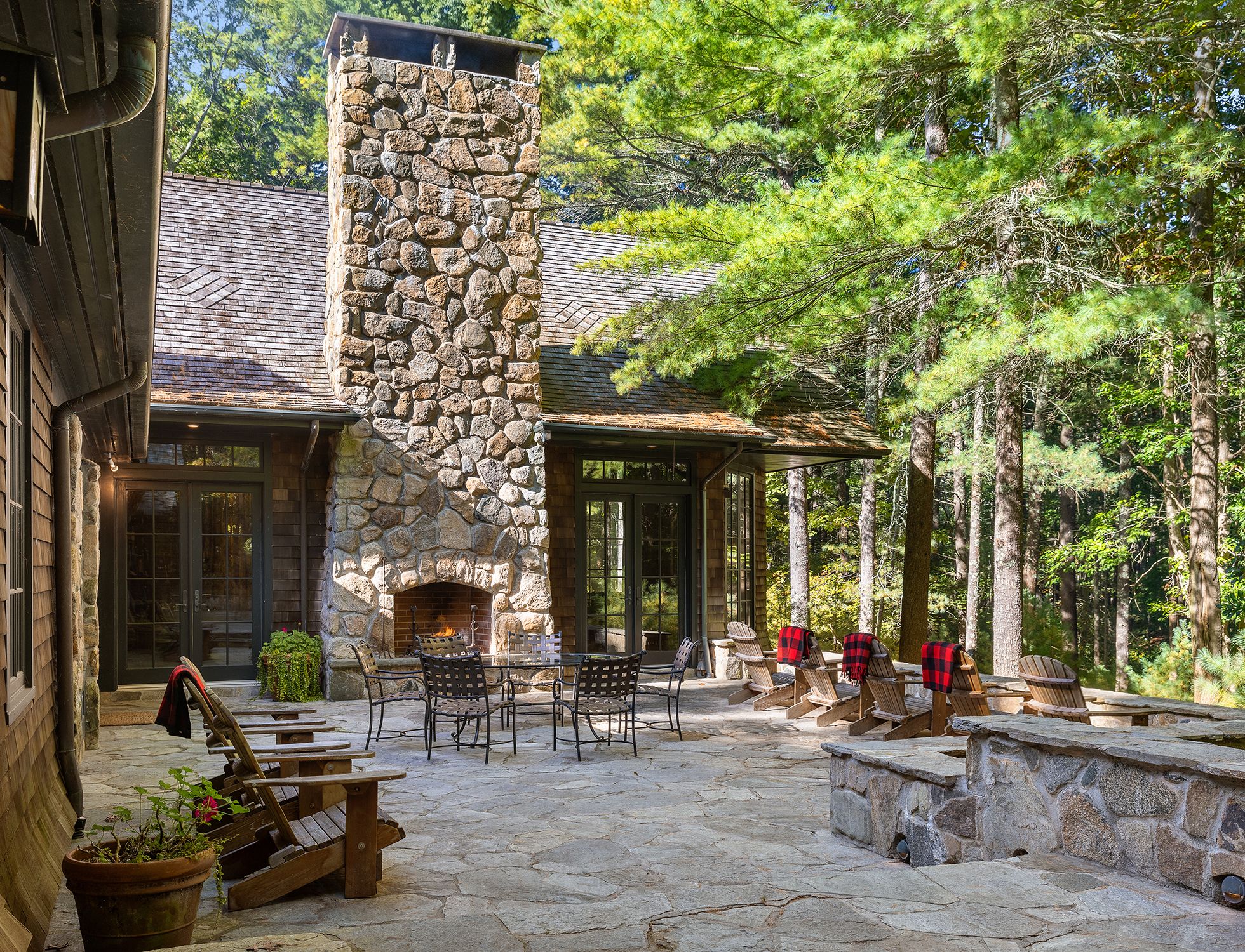9 Two Holes Of Water Road East Hampton, NY 11937 - Photo 11 of 52 a building outdoor space with patio furniture and potted plants
