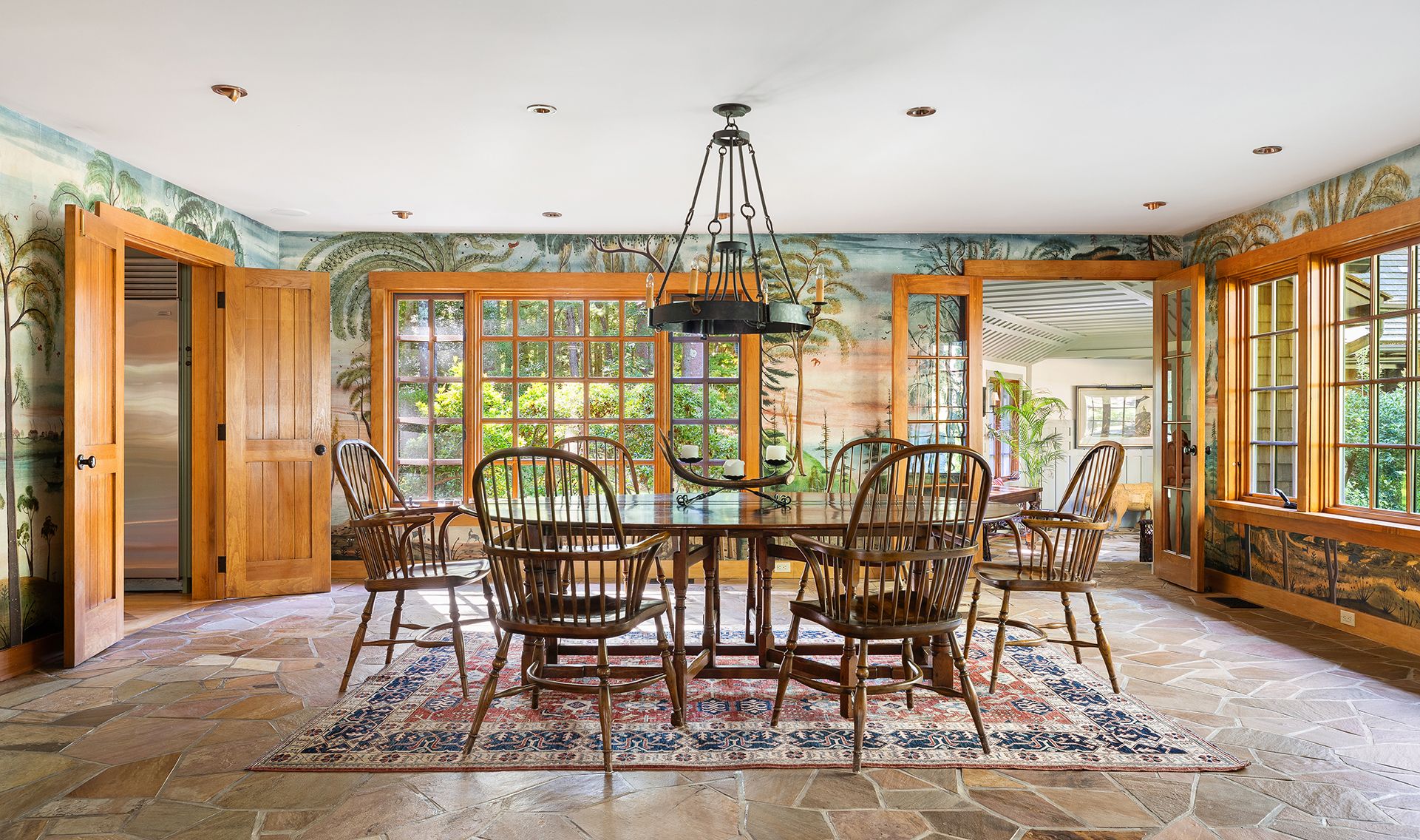 9 Two Holes Of Water Road East Hampton, NY 11937 - Photo 15 of 52 a dining room with furniture a chandelier and wooden floor