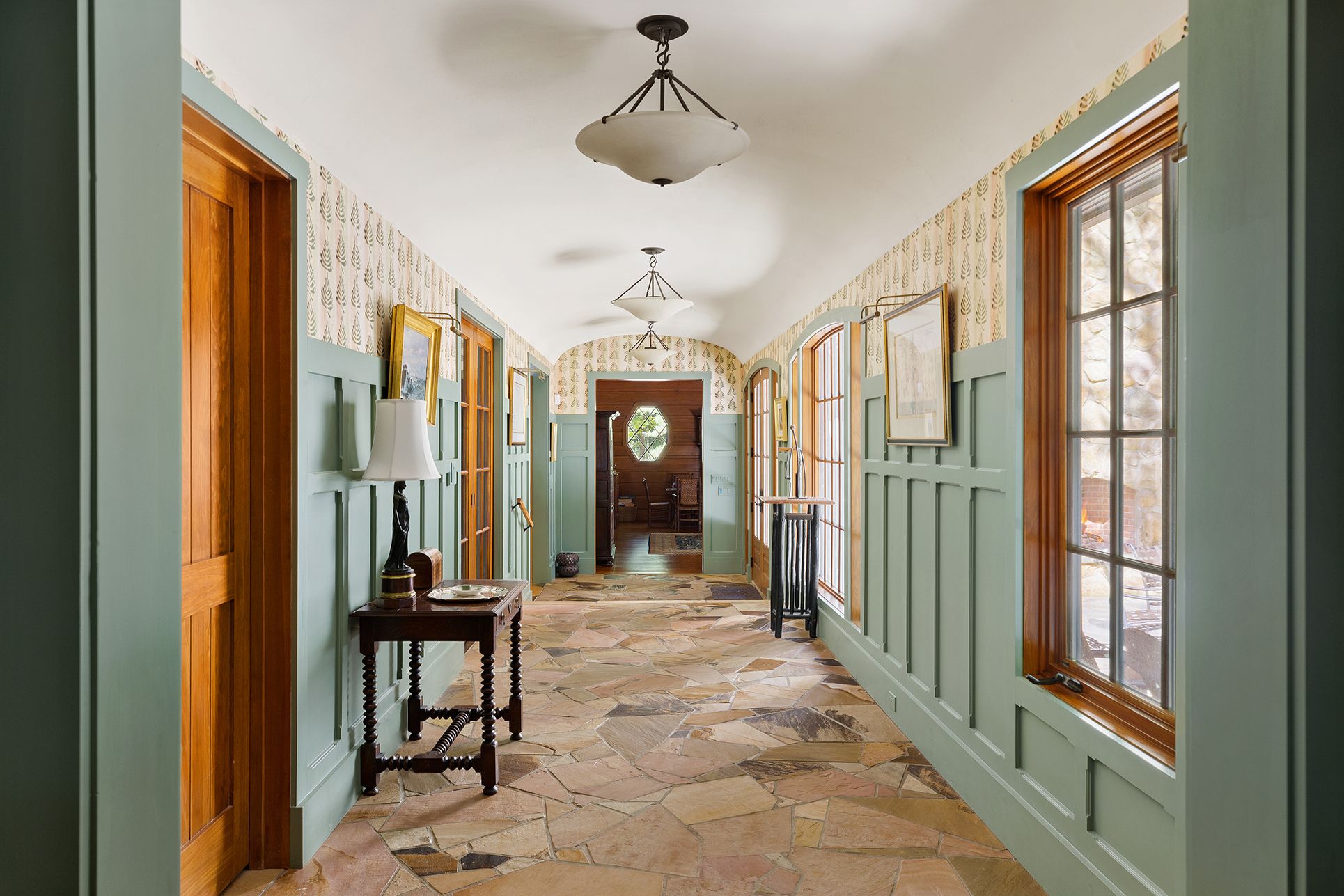 9 Two Holes Of Water Road East Hampton, NY 11937 - Photo 27 of 52 a view of a hallway with furniture and a chandelier
