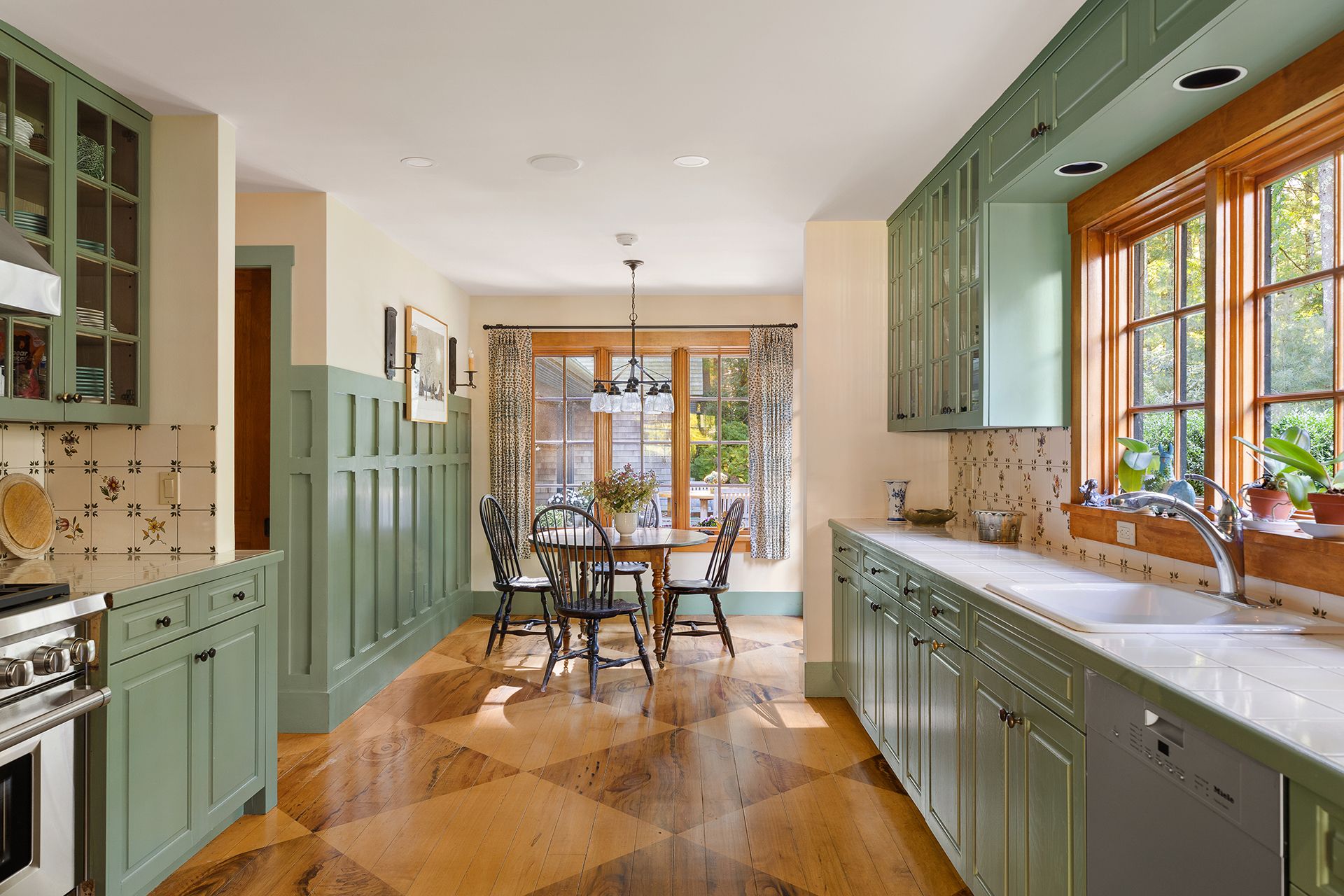 9 Two Holes Of Water Road East Hampton, NY 11937 - Photo 35 of 52 a large kitchen with kitchen island a large window a sink and stainless steel appliances