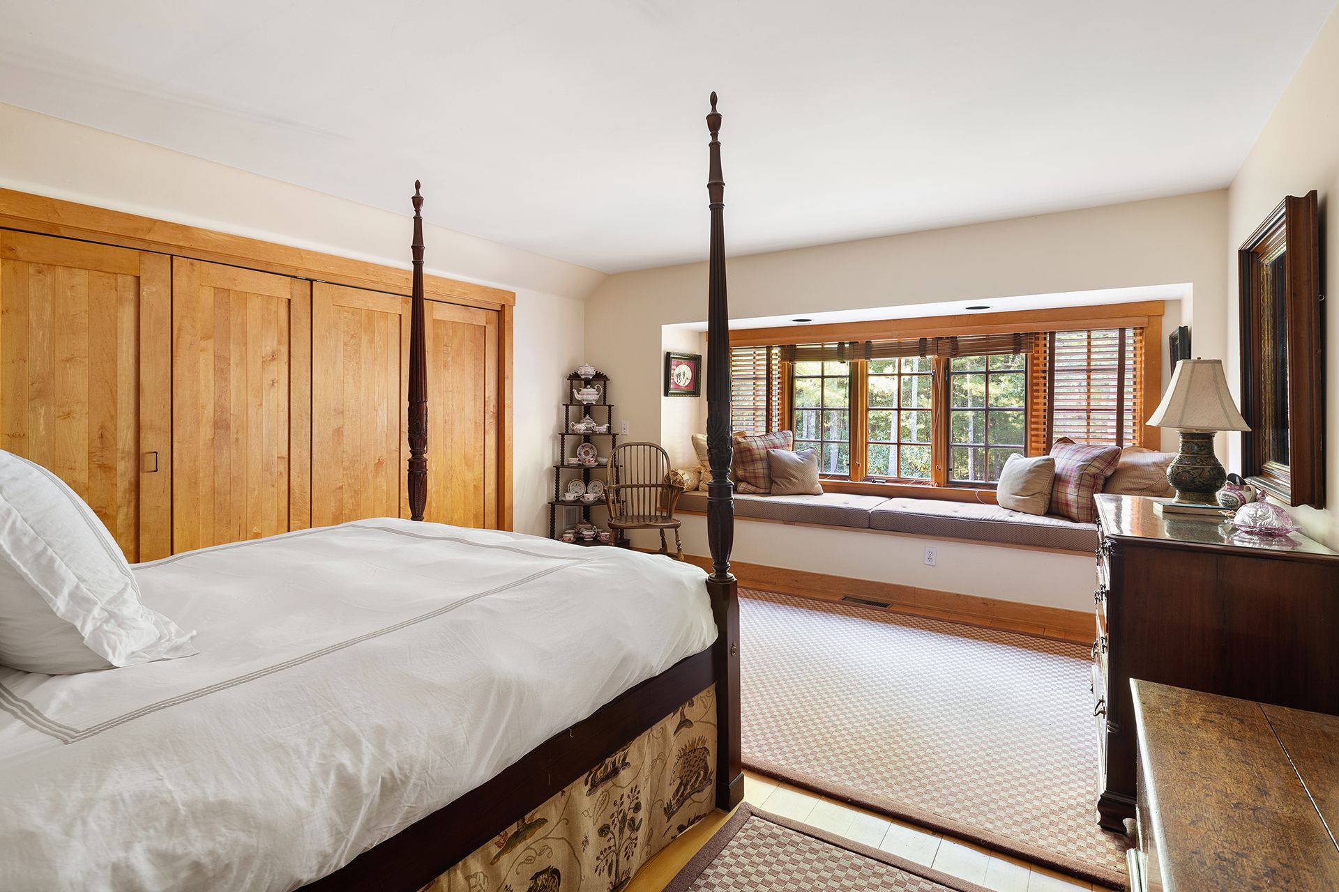 9 Two Holes Of Water Road East Hampton, NY 11937 - Photo 38 of 52 a large bed sitting in a bedroom next to a window