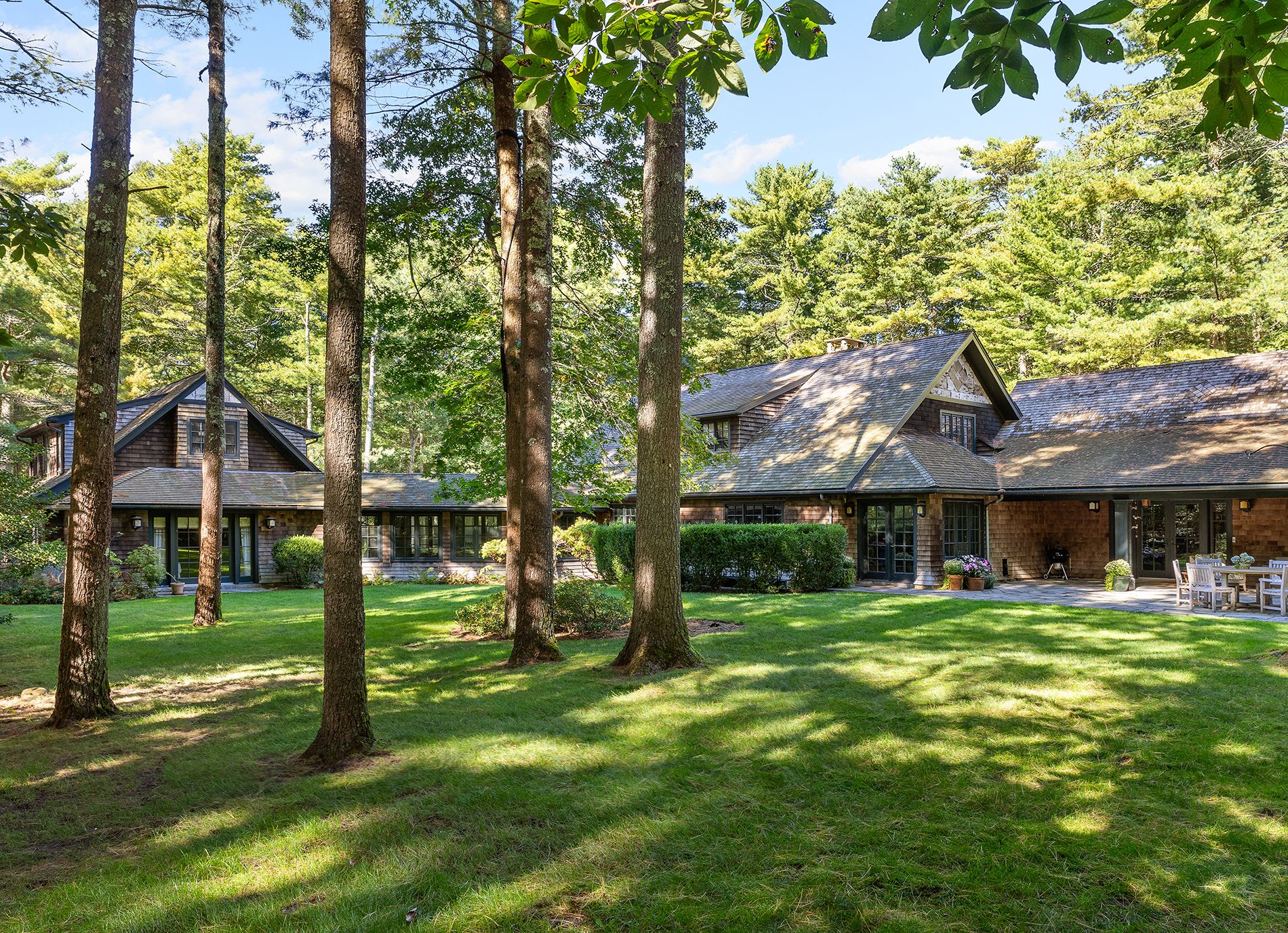 9 Two Holes Of Water Road East Hampton, NY 11937 - Photo 4 of 52 a front view of a house with a yard