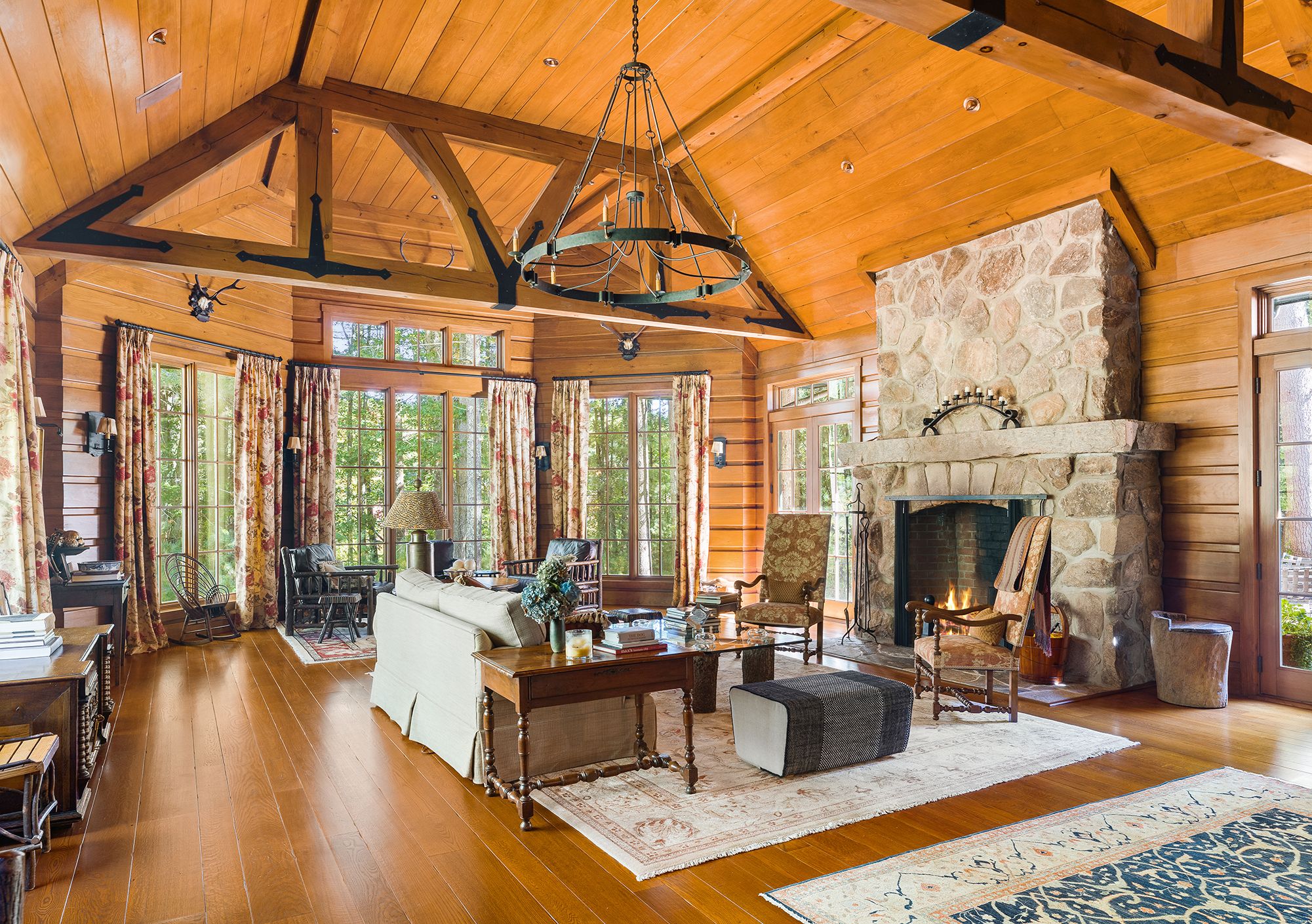 9 Two Holes Of Water Road East Hampton, NY 11937 - Photo 6 of 52 a living room with furniture a fireplace and floor to ceiling windows