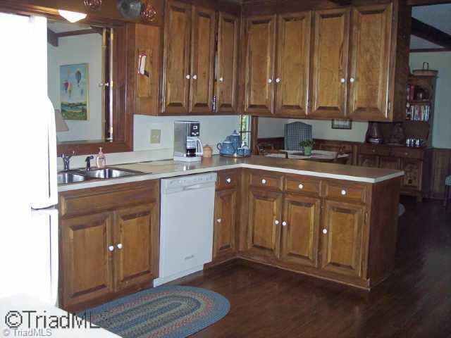 1814 Dantzler Road High Point, NC 27265 - Photo 2 of 9 Other. The kitchen has a built in microwave, built in range, dishwasher, and a cook top.