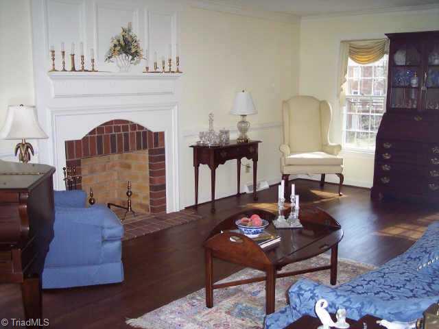 1814 Dantzler Road High Point, NC 27265 - Photo 7 of 9 Other. The living room has hardwood floors and a wood burning fireplace.