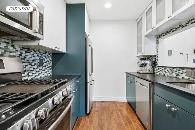a view of a patio with couches table and chairs and potted plants