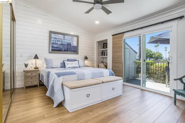 a spacious bedroom with a large bed and a window
