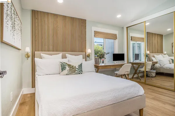 a spacious bedroom with a large bed and a couch