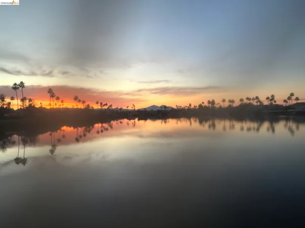 a view of a lake with a city