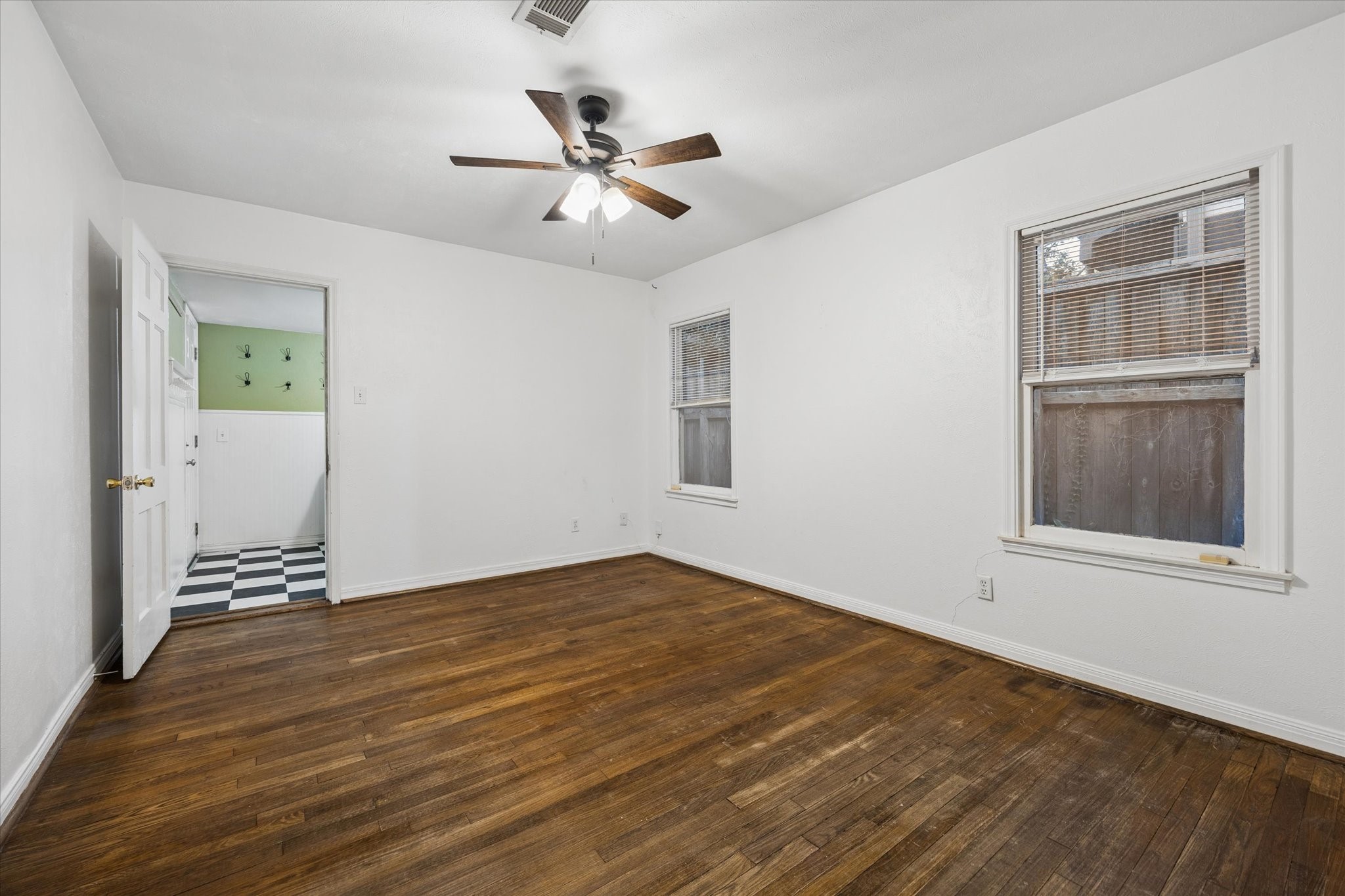 1931 Bissonnet Street Houston, TX 77005 - Photo 13 of 22 a view of empty room with wooden floor and fan