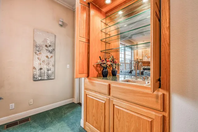 a view of a bedroom and wooden floor
