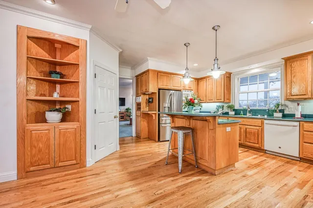 a bathroom with a granite countertop sink and a large mirror