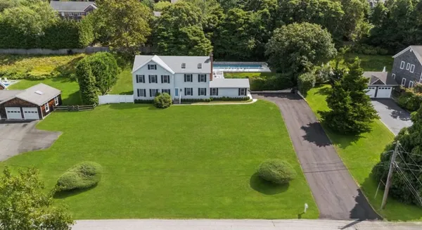 an aerial view of a house with a garden