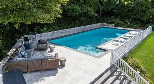 a view of a backyard with sitting area