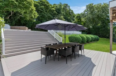 an outdoor space with furniture and umbrella