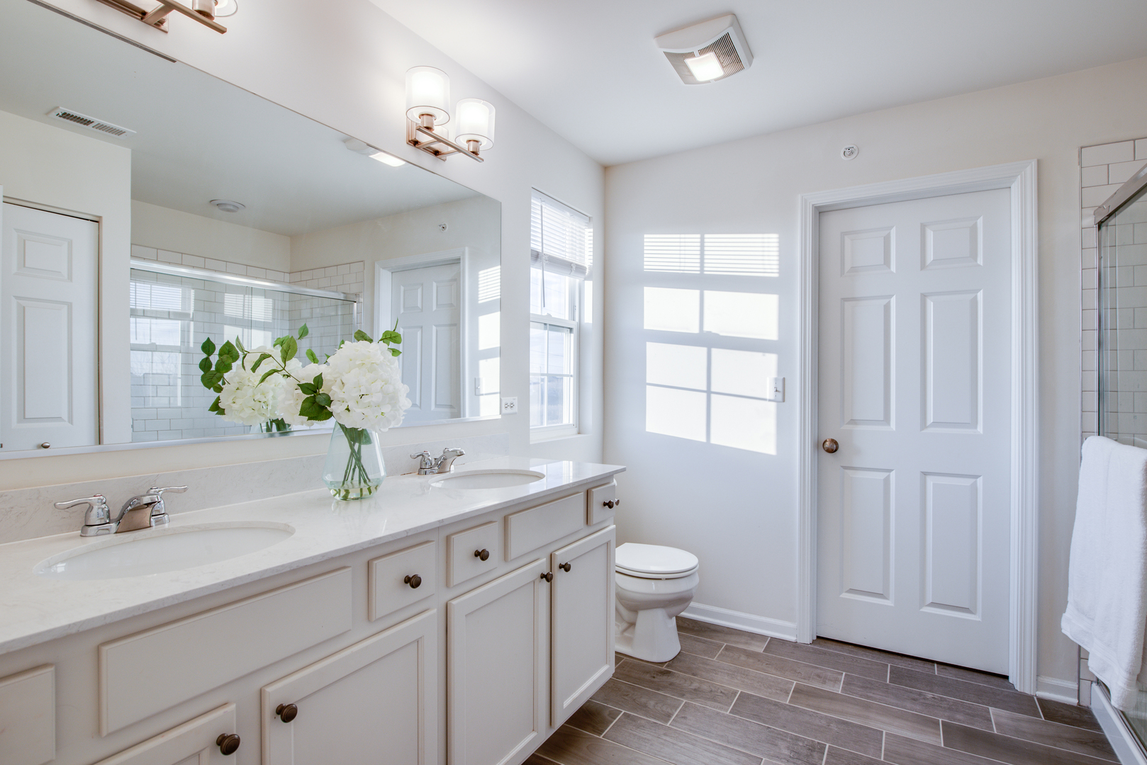 4477 Monroe Court Naperville, IL 60564 - Photo 15 of 23 a bathroom with a granite countertop sink and a large mirror