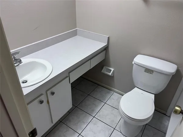 a bathroom with a toilet and a sink