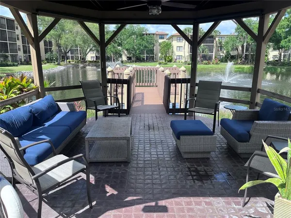 a outdoor living space with patio furniture and a potted plant
