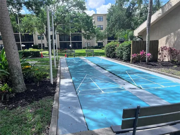a view of a backyard with sitting area