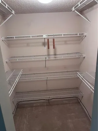 a view of a room with racks on the wall