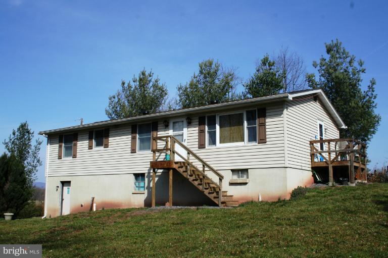 10807 Haughs Church Road Keymar, MD 21757 - Photo 1 of 17 a front view of a house with garden
