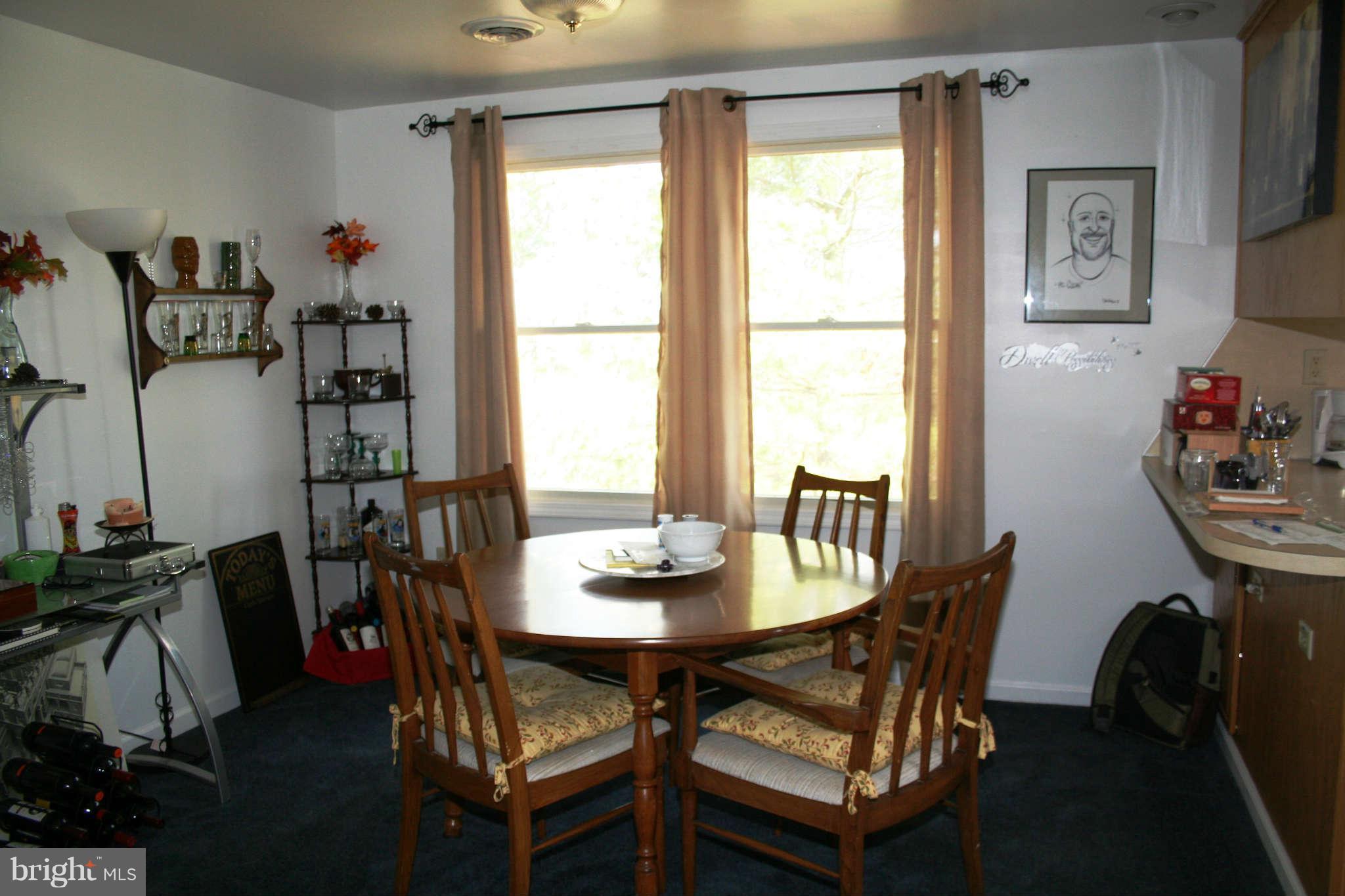 10807 Haughs Church Road Keymar, MD 21757 - Photo 3 of 17 a dining room with furniture and window