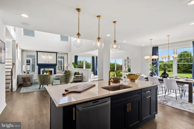 a view of a kitchen and dining room