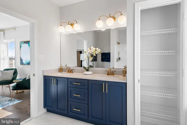 a bathroom with a double vanity sink and a mirror