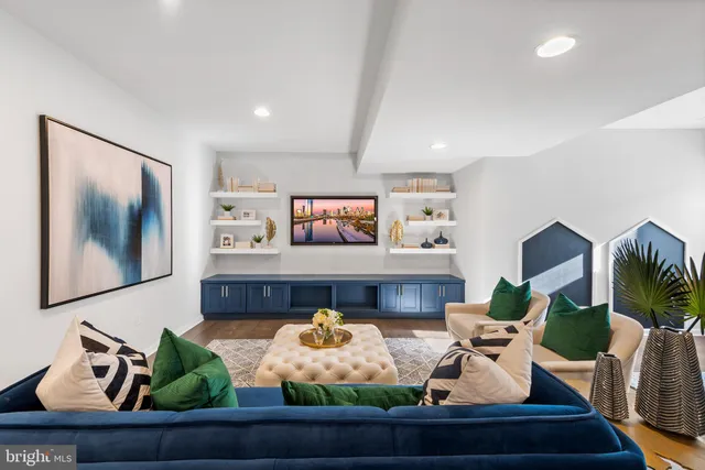 a living room with furniture a dining table and a fireplace