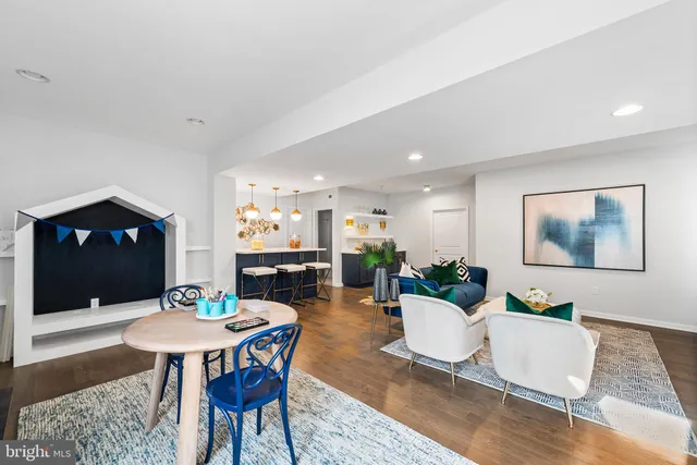 a view of a room that has a table and chairs in it