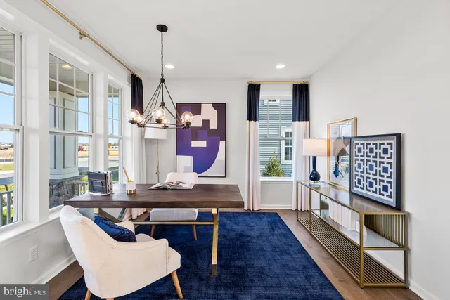 a dining room with furniture and wooden floor