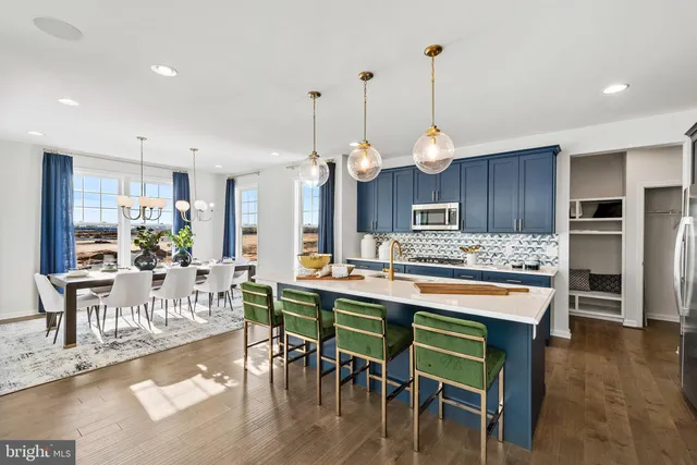 a large kitchen with a table and chairs