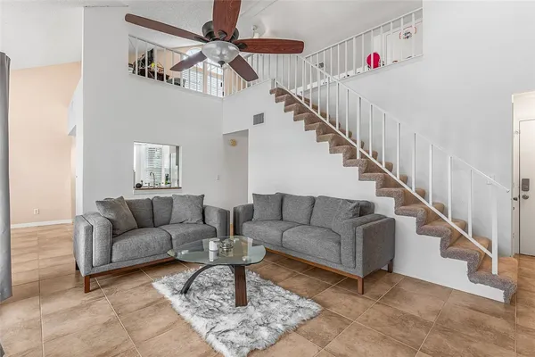 a living room with furniture and white walls