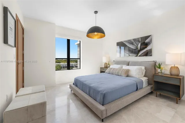 a bedroom with a bed and window