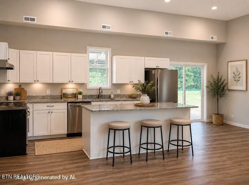 246 Ralph Spivey Lane Hilham, TN 38568 - Photo 11 of 53 a kitchen with granite countertop a stove a sink dishwasher and a refrigerator