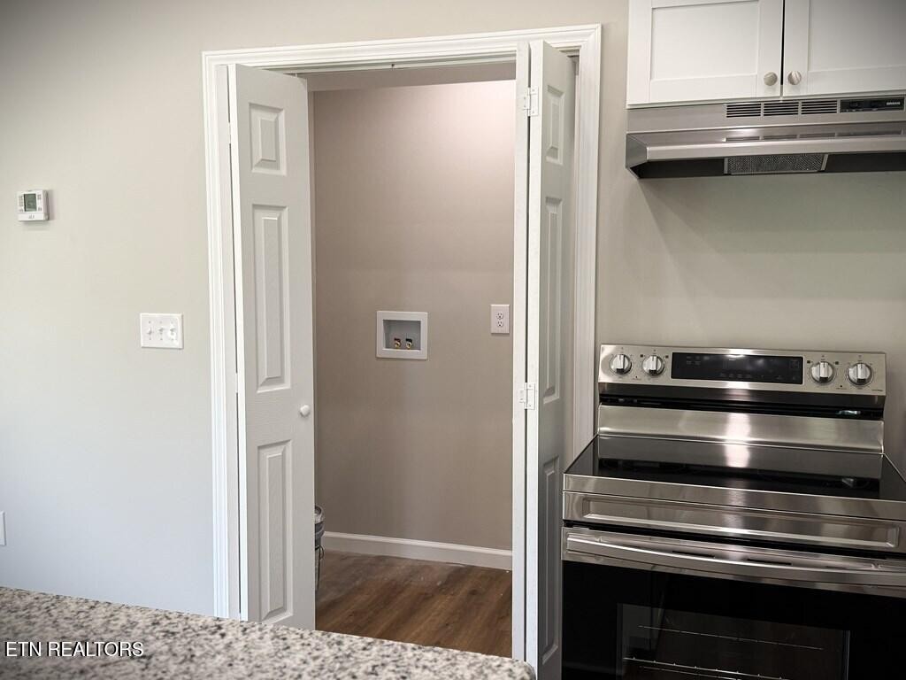246 Ralph Spivey Lane Hilham, TN 38568 - Photo 13 of 53 a kitchen with a stove and a refrigerator