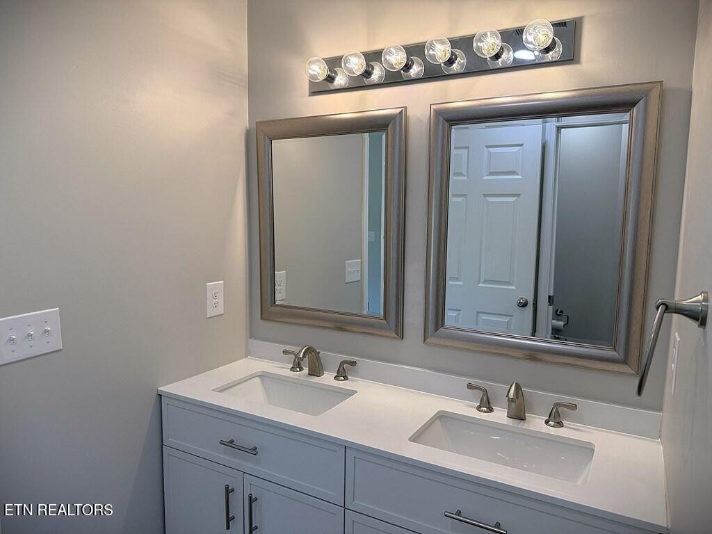 246 Ralph Spivey Lane Hilham, TN 38568 - Photo 25 of 53 a bathroom with a sink and a mirror