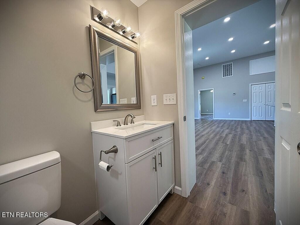 246 Ralph Spivey Lane Hilham, TN 38568 - Photo 34 of 53 a spacious bathroom with a toilet sink and mirror