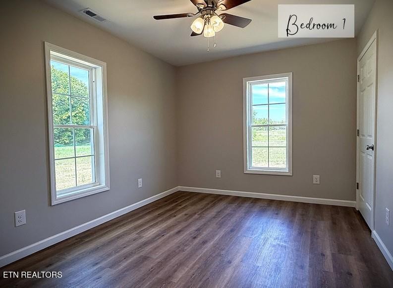 246 Ralph Spivey Lane Hilham, TN 38568 - Photo 46 of 53 a view of an empty room with wooden floor and a window