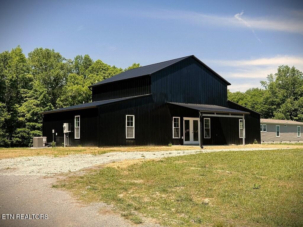 246 Ralph Spivey Lane Hilham, TN 38568 - Photo 5 of 53 a house that has a tree in front of it