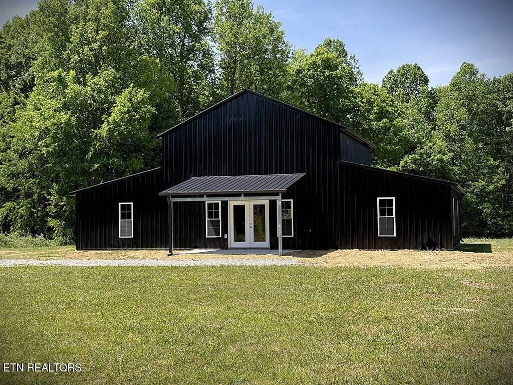 246 Ralph Spivey Lane Hilham, TN 38568 - Photo 52 of 53 a front view of a house with a yard
