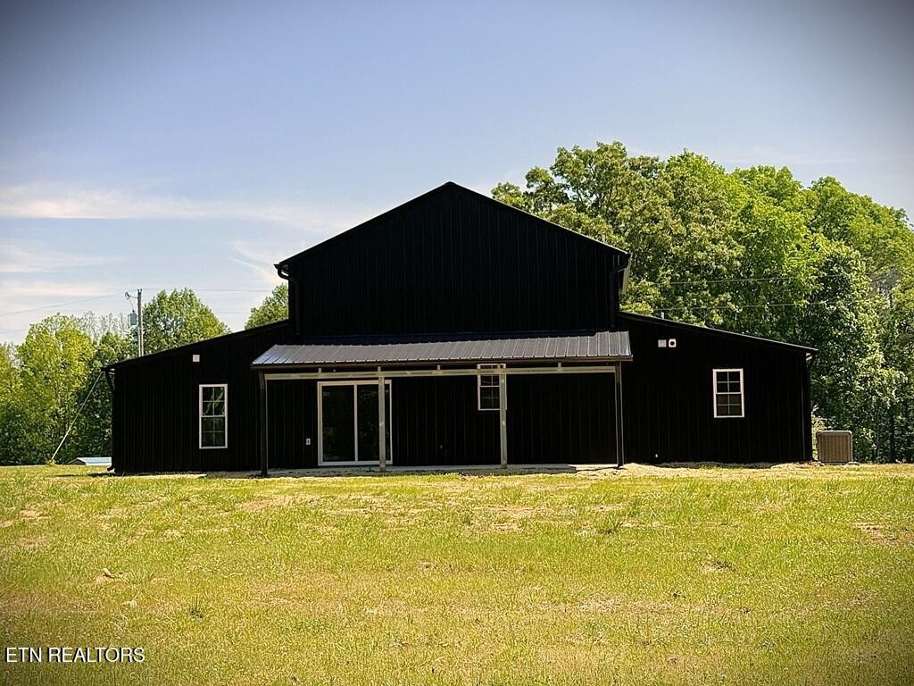 246 Ralph Spivey Lane Hilham, TN 38568 - Photo 53 of 53 a front view of a house with a yard
